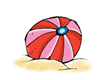 Beach ball resting in sand.